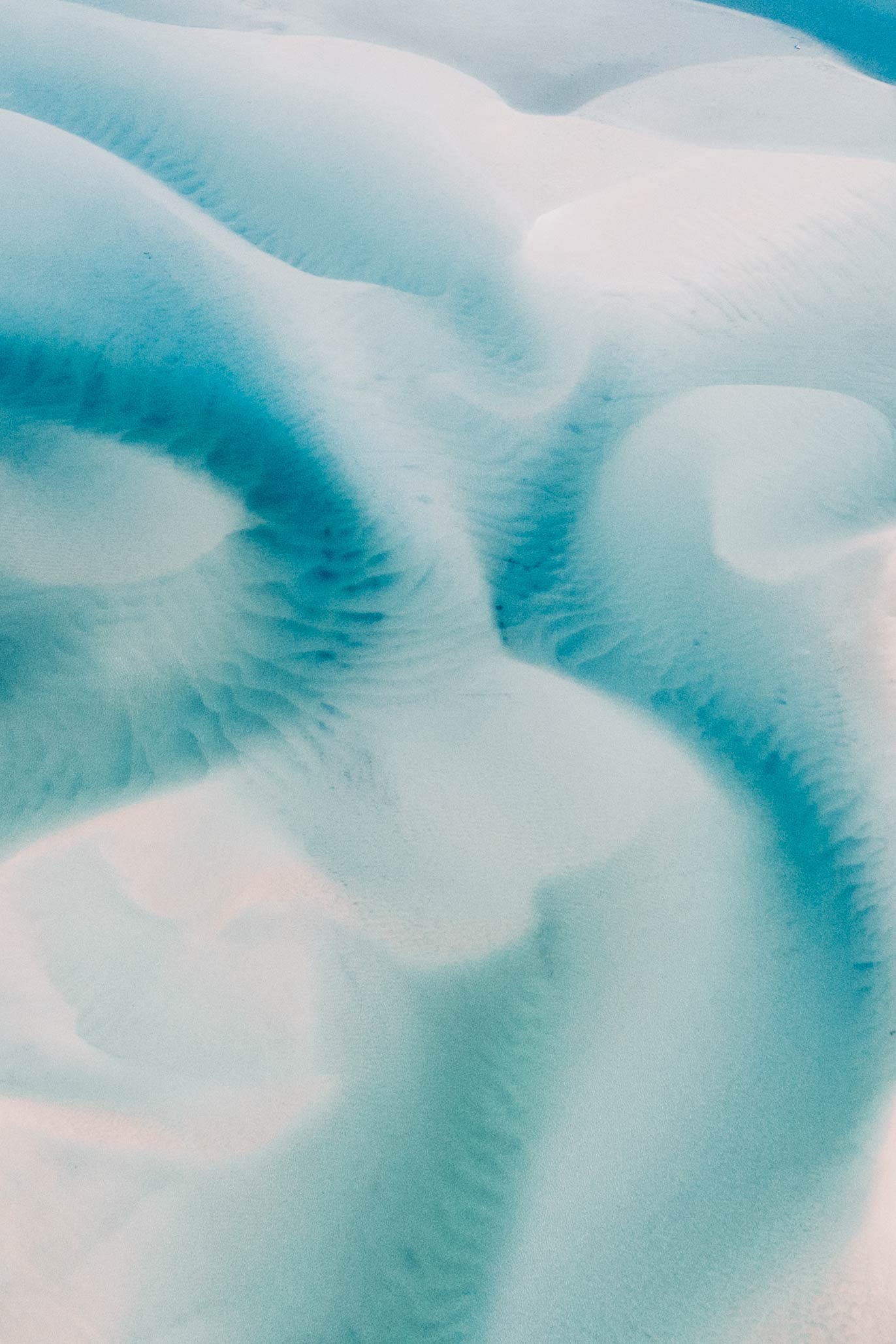 Noosa From Above by Will Salkeld, aerial abstract of sand and turquoise tide channels along the Queensland coast, colour photography.
