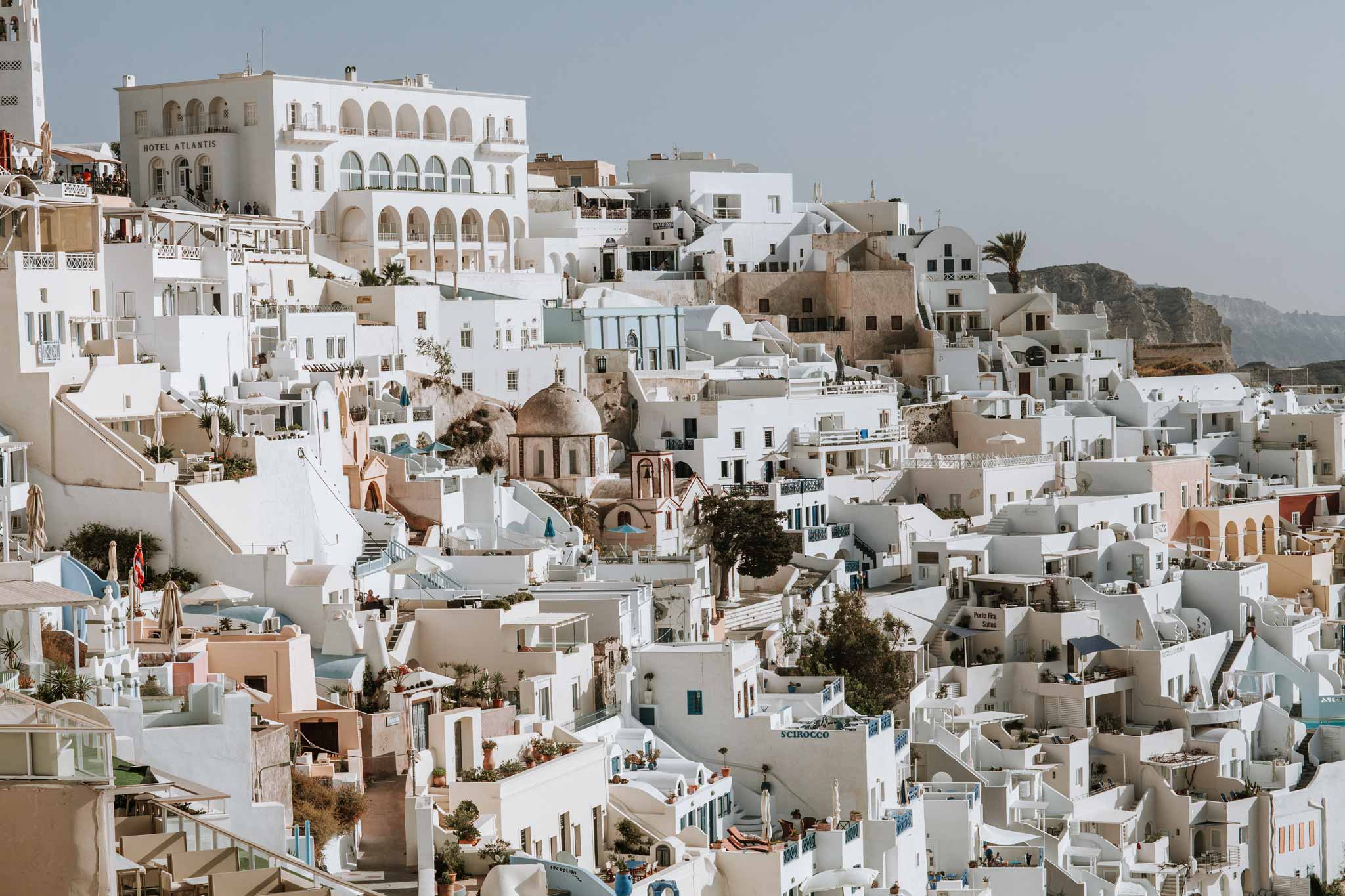 Fira Form by Will Salkeld, colour photograph of layered whitewashed Cycladic architecture stacking down the volcanic cliffs of Fira, Santorini