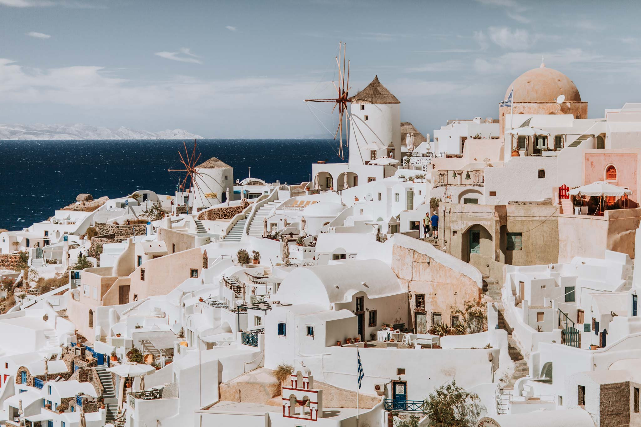 Fira Form II by Will Salkeld, colour photograph of Oia Santorini with windmills, whitewashed buildings and the Aegean at sunset
